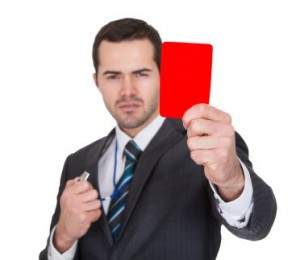 Businessman showing red card