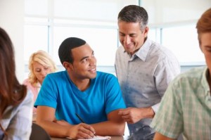 Tutor helping student in class